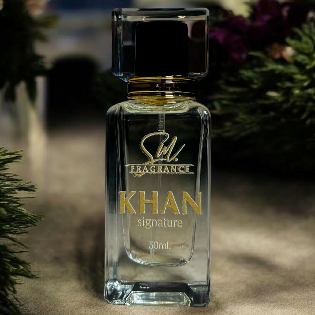 Perfume bottle labeled 'Khan Signature' by SUL on a textured surface with blurred greenery in the background.
