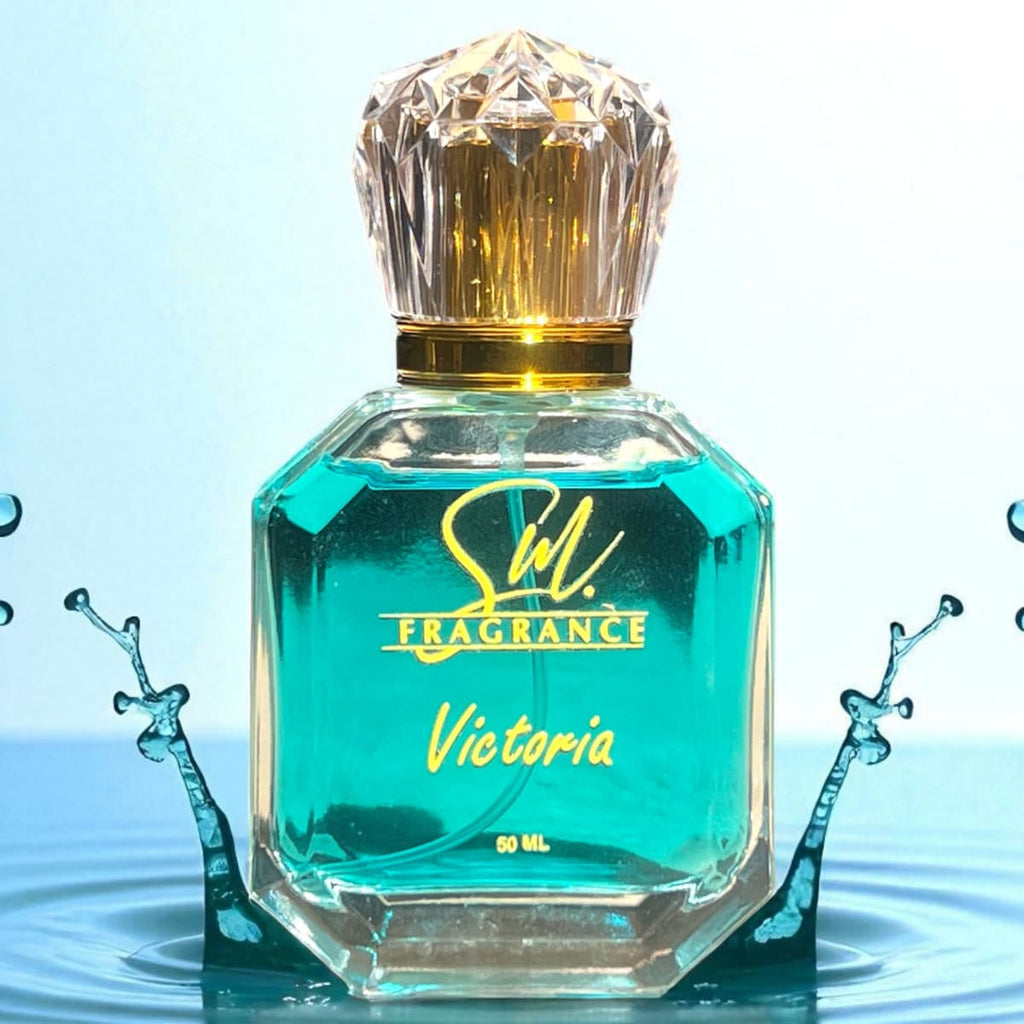 Perfume bottle with 'Sil Fragrance Victoria' on a water surface